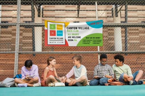 Children studying together under a Math Club banner